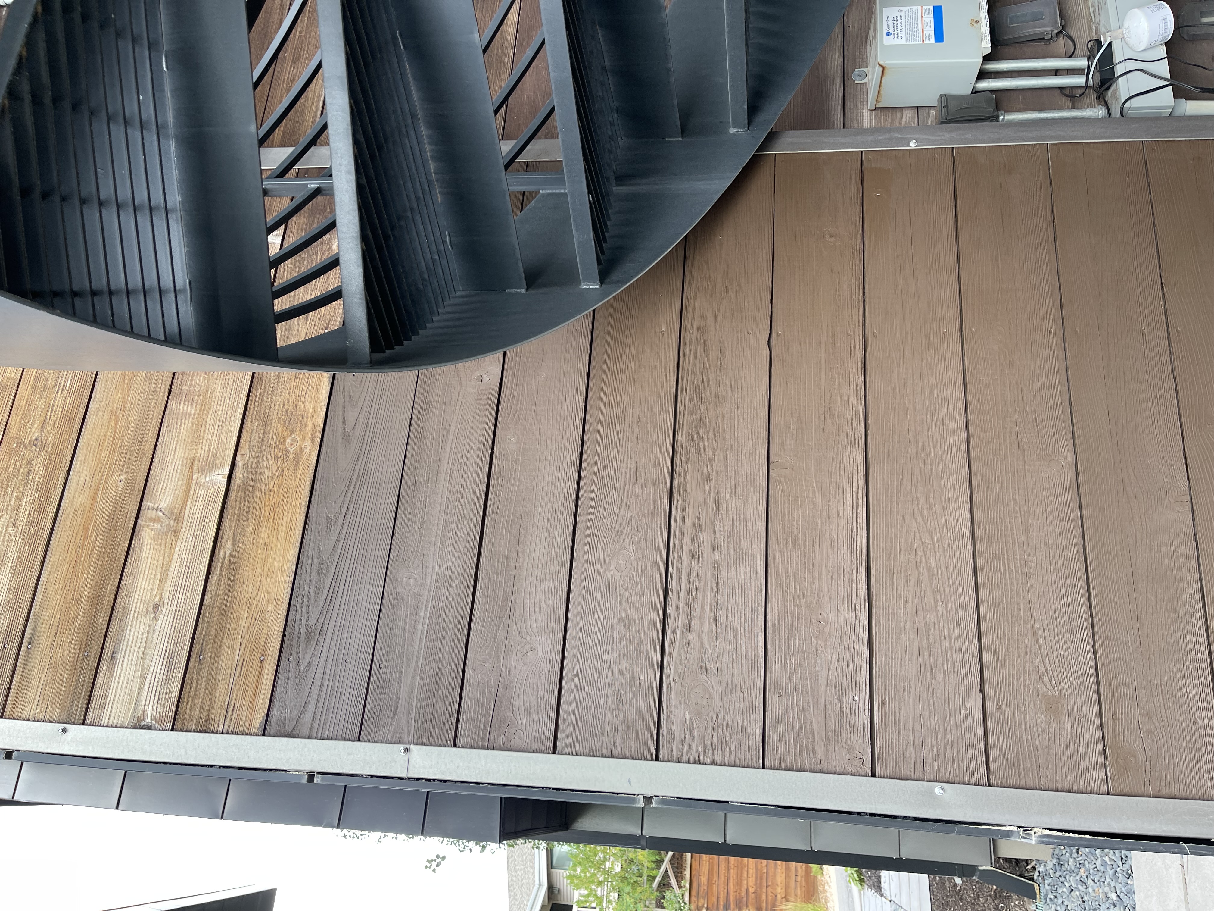 Close-up of modern wood siding showing stain detail and metal accents — exterior staining Utah